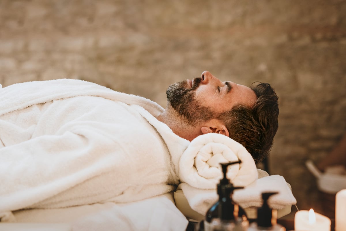 Man in spa salon receiving massage and wellness treatment